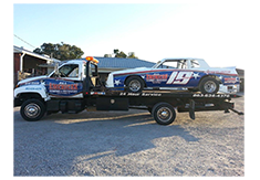 Truck wrap and race car wrap designed by Custom Graphics and Signs