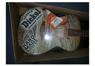 Guitar wrap designed by Custom Graphics and Signs