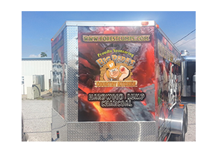 Trailer wrap front view designed by Custom Graphics and Signs