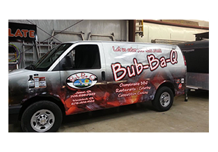 Full van wrap designed by Custom Graphics and Signs