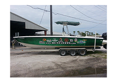 Boat wrap designed by Custom Graphics and Signs