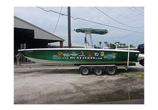 Boat wrap designed by Custom Graphics and Signs