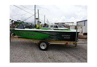 Boat wrap designed by Custom Graphics and Signs