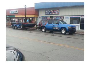 SUV and Boat wrap designed by Custom Graphics and Signs