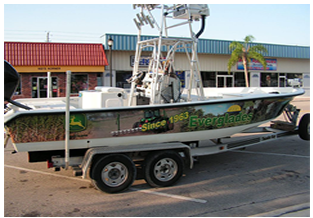 Boat wrap designed by Custom Graphics and Signs